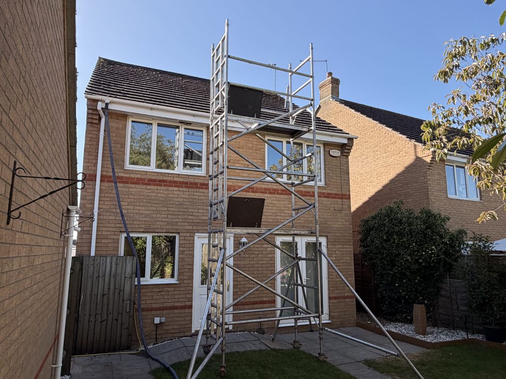 setting up a scaffold tower for a roof clean in Northampton