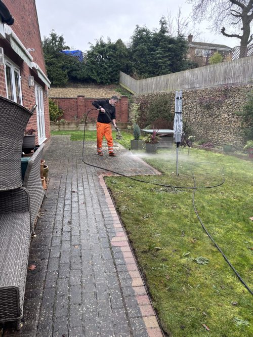 Patio pressure washing in progress